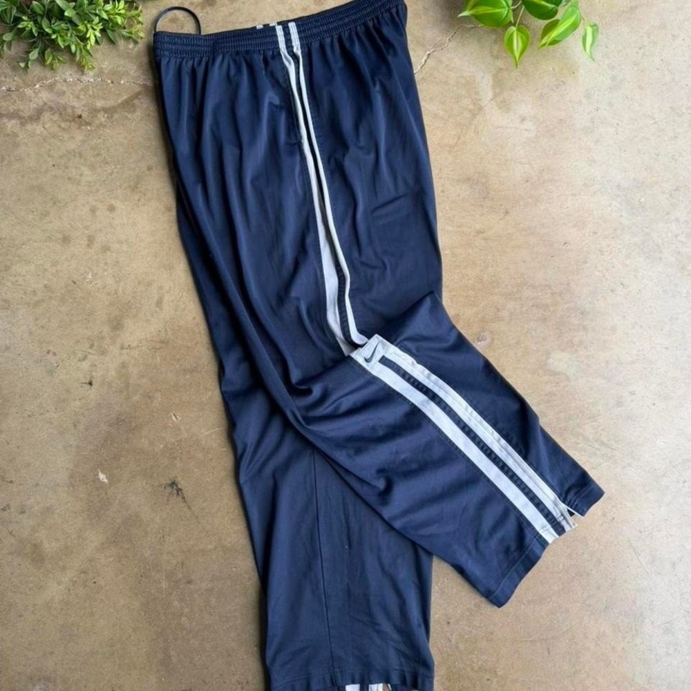 Vintage y2k Nike navy blue track pants with white stripes size XL